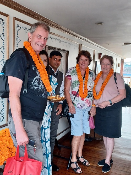 Traditional marigold lei greeting and Hindu Bindi applied on our welcome aboard the ship.